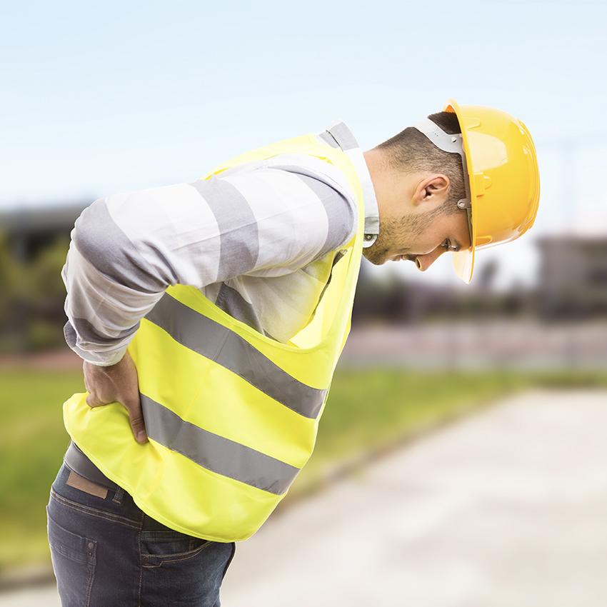 construction worker in yellow vest feeling back pain