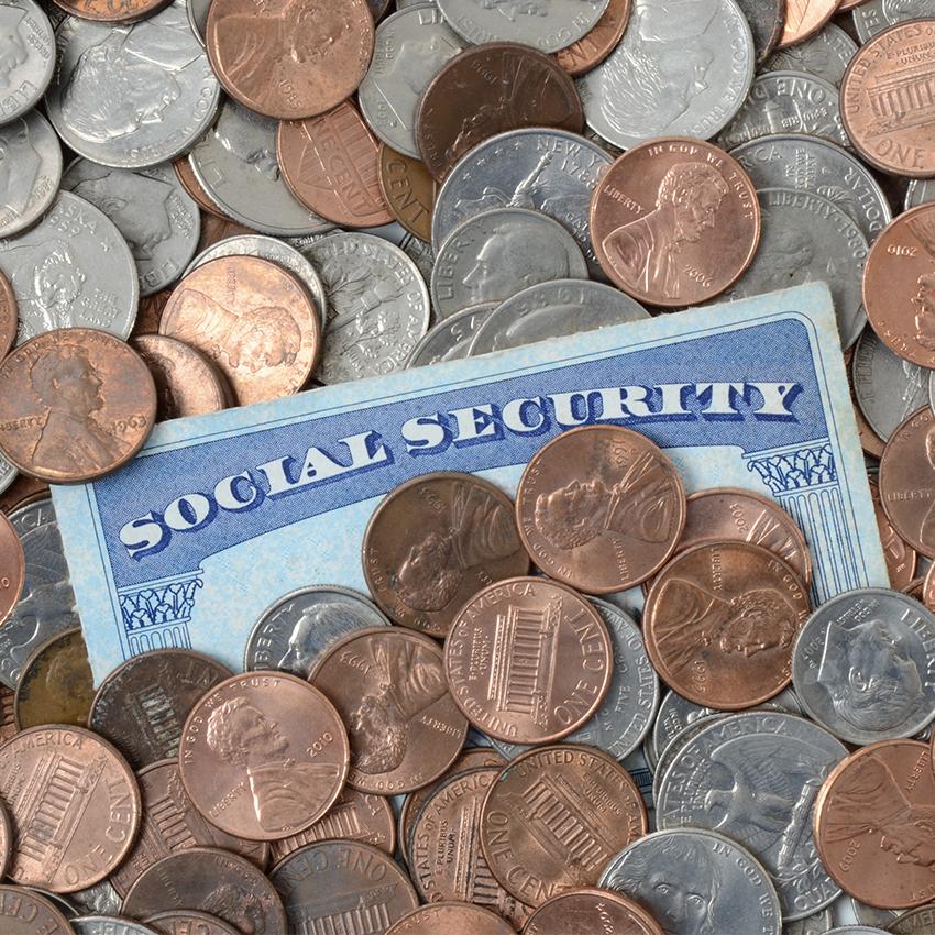 social security card in pile of change