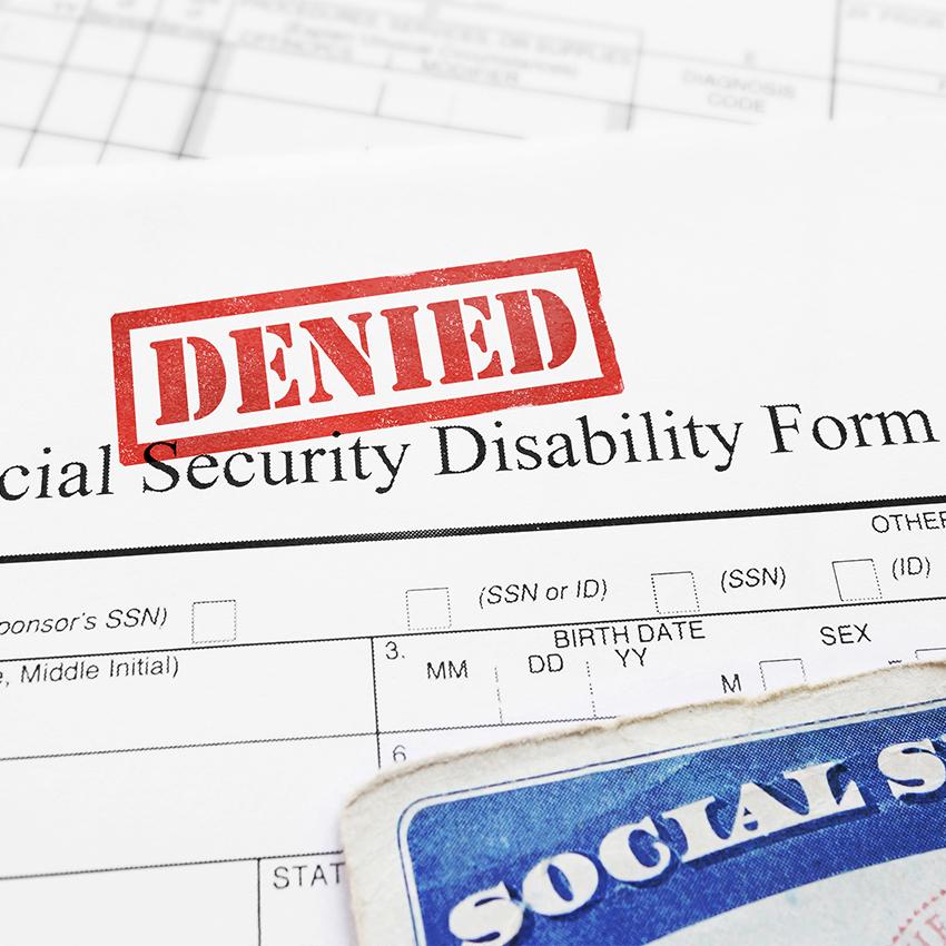 social security card and application stamped "denied" in red