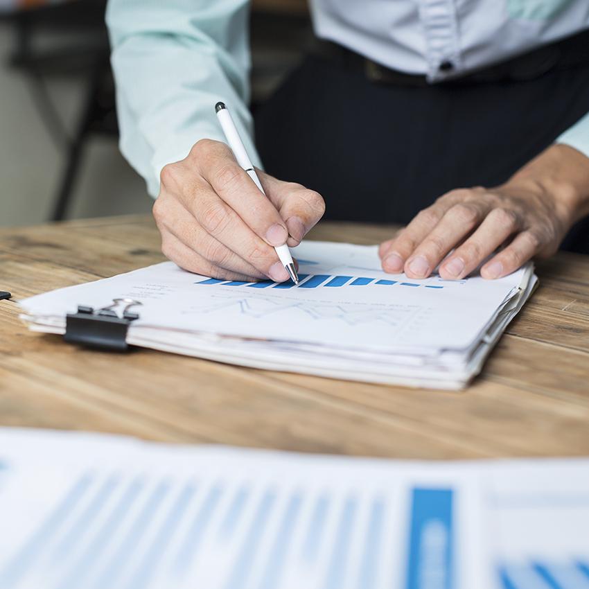 man looking at papers