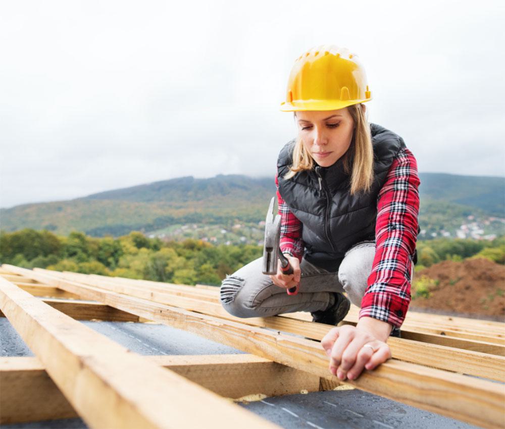 Construction worker roofing.