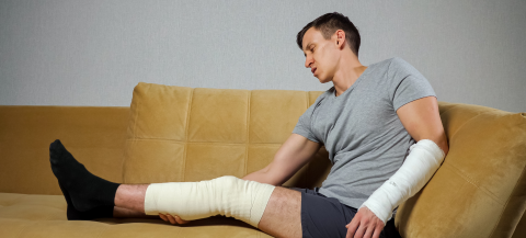 Man stuck on the couch after injuring leg and arm in a workplace accident