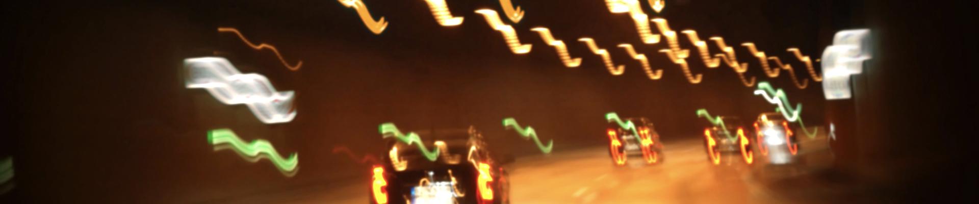 blurred photo of cars driving at night